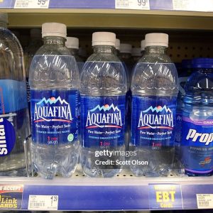 CHICAGO - JULY 27:  Bottles of Pepsi's Aquafina water sit on a shelf next to other brands of bottled water at a Walgreens store July 27, 2007 in Chicago, Illinois.  Pepsi announced today that the labels on its Aquafina water will be changed to say the product is tap water. Coke admitted in 2004 that its Dasani water was tap water.  (Photo by Scott Olson/Getty Images)